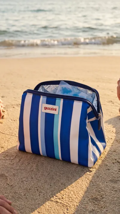 The cooler bag resting on the sand